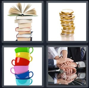 books in a pile with one open, silver and gold coins, rainbow cups washed, hands in pile on table